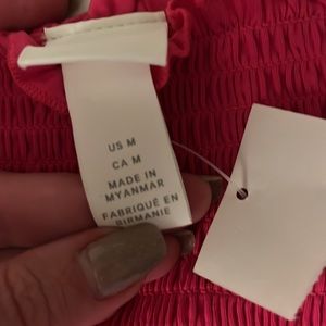 Bright pink ribbed tube top